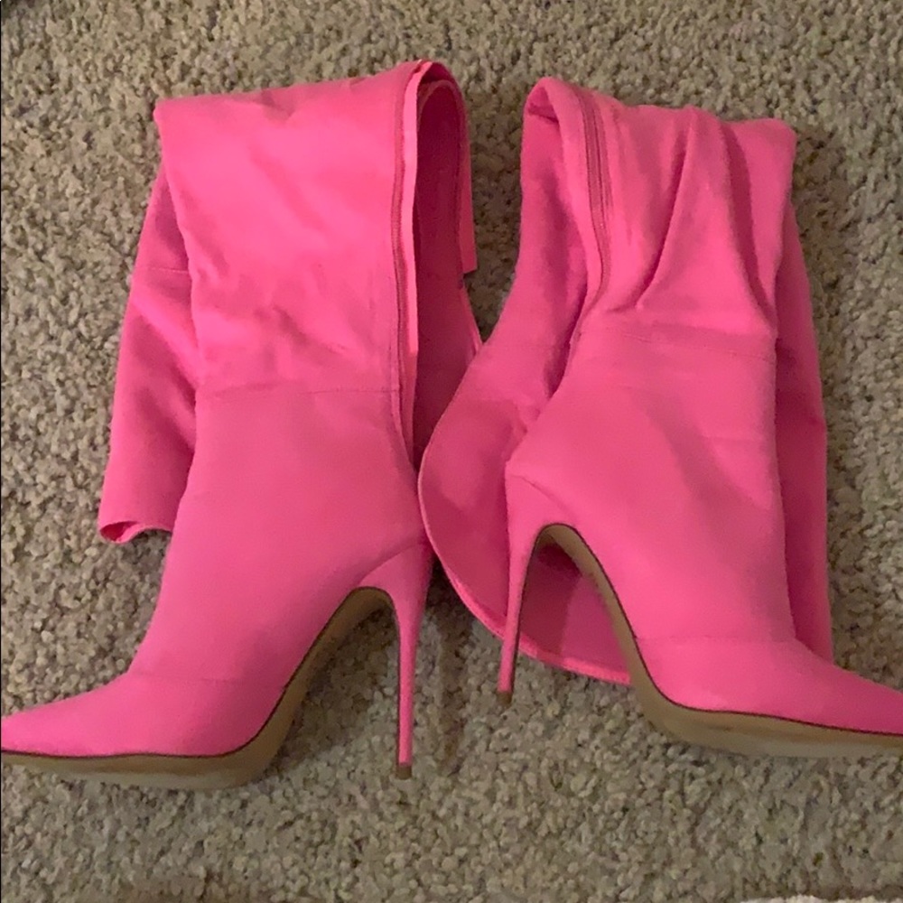 Bright pink knee high boots